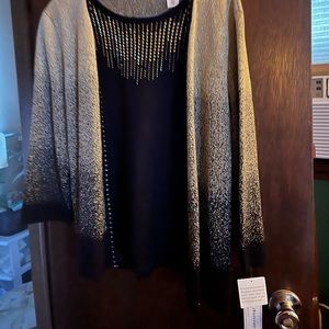 This is an Alfred Dunner one piece dressy blouse. black and gold. Size medium